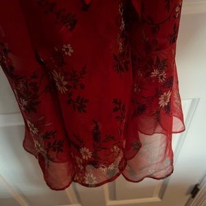 Vince Camuto sheer like material in floral with tie waist. Hem line is angled!